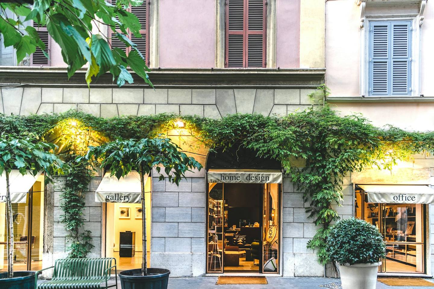 A street of local shops with ivy-covered shopfronts