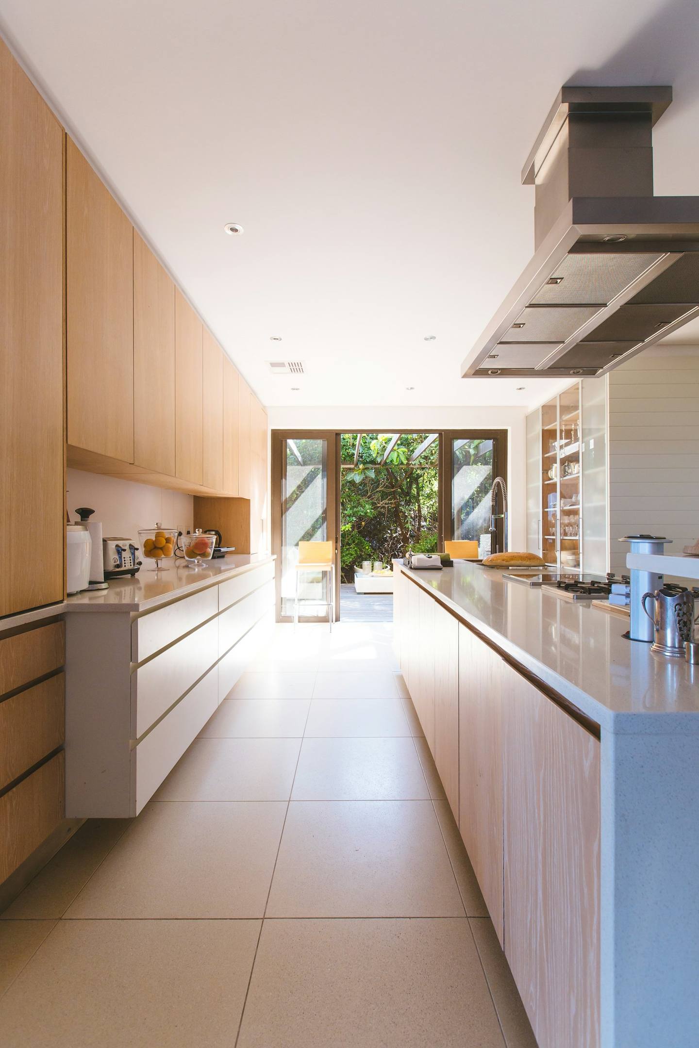 A bright, freshly renovated kitchen with timber cabinetry